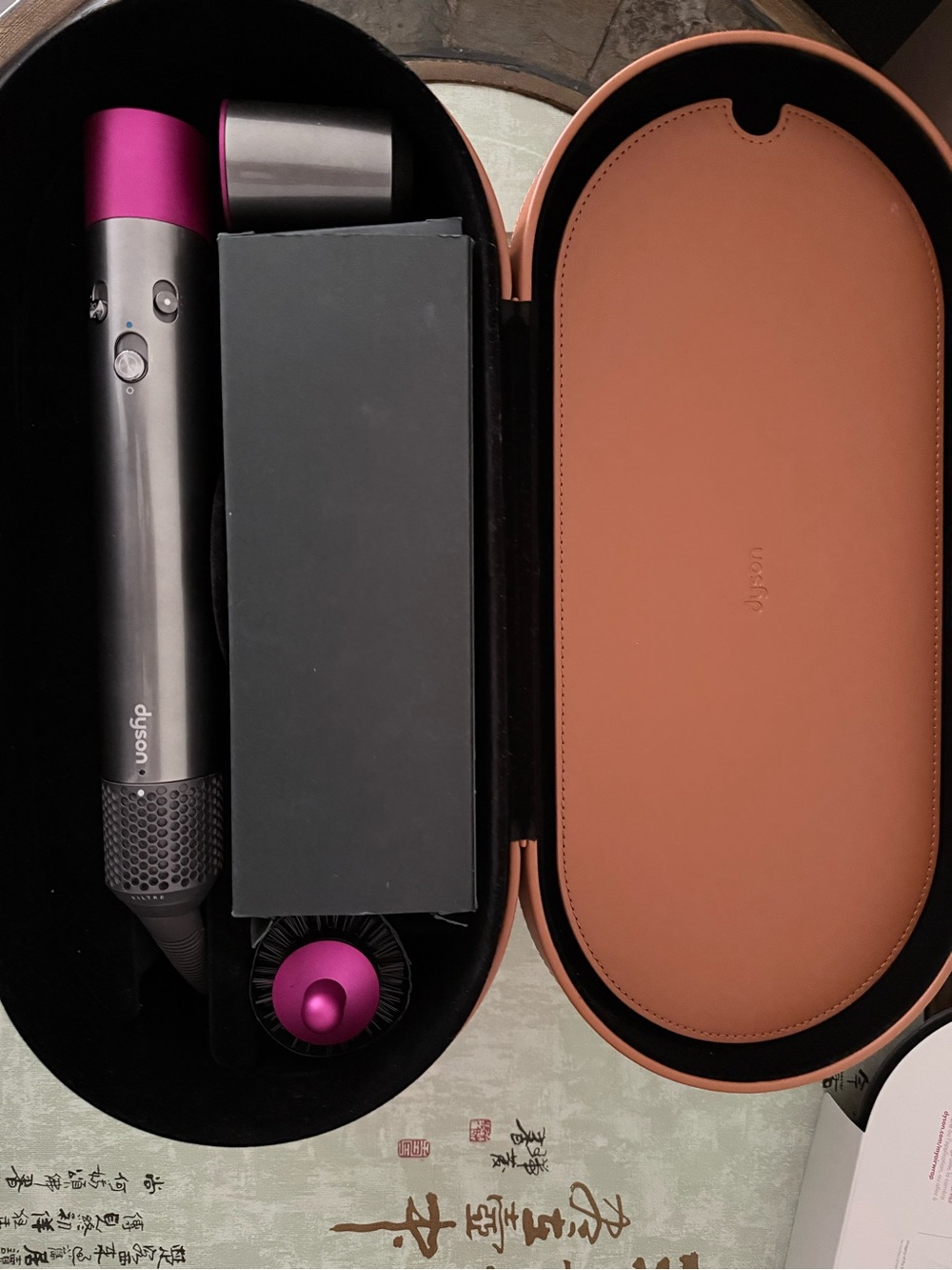 Dyson styling set in gunmetal and magenta with tan case